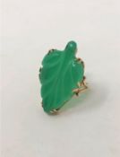 A gold mounted jade ring, size Q1/2