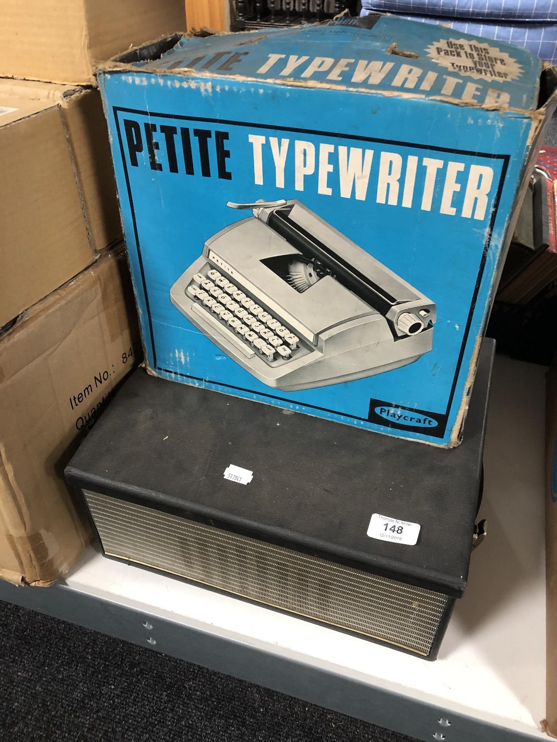 A cased Petite typewriter and a vintage Ferguson reel to reel