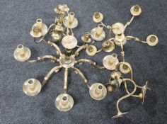 A brass eight arm chandelier together with a further brass light and three arm chandelier,