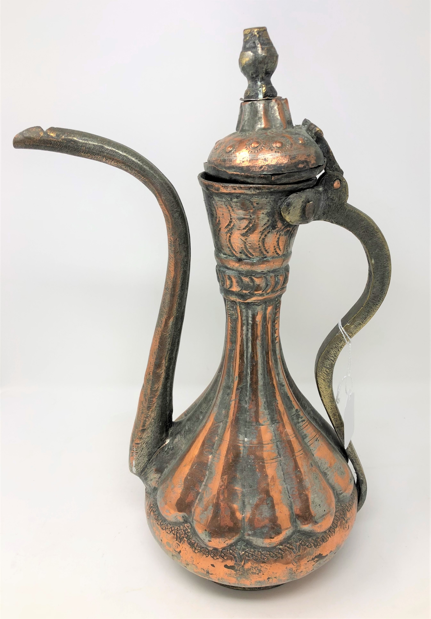 A nineteenth century Persian copper and silvered metal Dallah, height 38.5 cm.