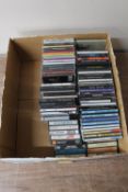 A box of CD's and cassette tapes : Michael Jackson, The Shadows,