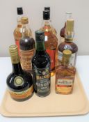 A tray of nine bottles of alcohol to include Southern Comfort, Lindisfarne Meade ,