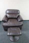 A brown leather armchair and footstool