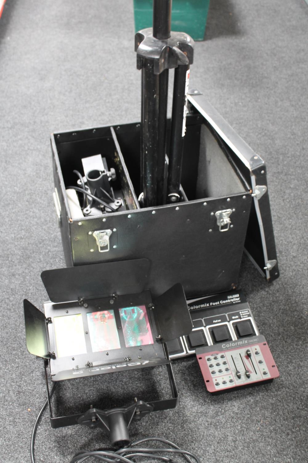 A storage box containing a Proel tripod together with two stage lights and two colour mix control