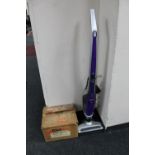 A Vax Dynamo Power cordless vacuum and a boxed magazine slide projector