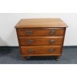 An antique pine three drawer chest