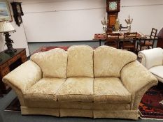 A three seater settee upholstered in gold classical brocade fabric