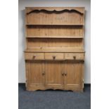 An antique pine kitchen dresser