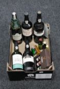 A box of five late 20th century bottles of port and a assorted alcohol miniatures including Baileys,