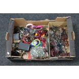 A box of a bag of marbles, assorted costume jewellery, watches,