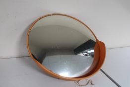 A mid 20th century convex security mirror