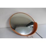 A mid 20th century convex security mirror