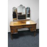 A 1930's mahogany dressing table with triple mirror