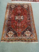 An antique Kashgai rug 117 cm x 175 cm