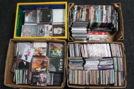 Four boxes of assorted DVD's and CD's