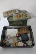 A collection of tins and medals relating to Royal Coronations,