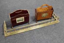 An antique brass fire curb and two 20th century magazine racks