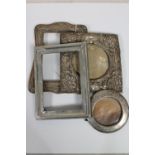 Four antique silver photograph frames.