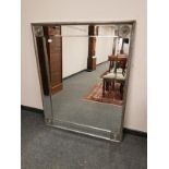 A contemporary silvered framed mirror