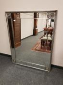 A contemporary silvered framed mirror