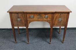 A George III mahogany sideboard on tapered legs