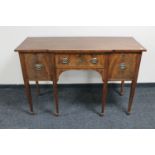 A George III mahogany sideboard on tapered legs