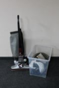 A Kirby Heritage II upright vacuum and a crate of Kirby vacuum accessories