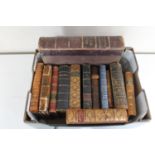 A box of thirteen antique leather bound volumes