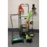 A petrol strimmer, push mower,