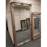 A silvered framed free standing mirror,