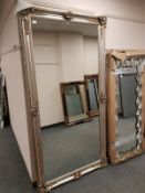 A silvered framed free standing mirror,