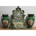 A late nineteenth century china mantel clock and pair of transfer printed vases