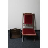 An Edwardian mahogany folding chair upholstered in a pink dralon together with an Edwardian oak
