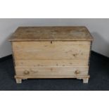 An antique pine blanket chest fitted a drawer