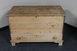 An antique pine blanket chest fitted a drawer