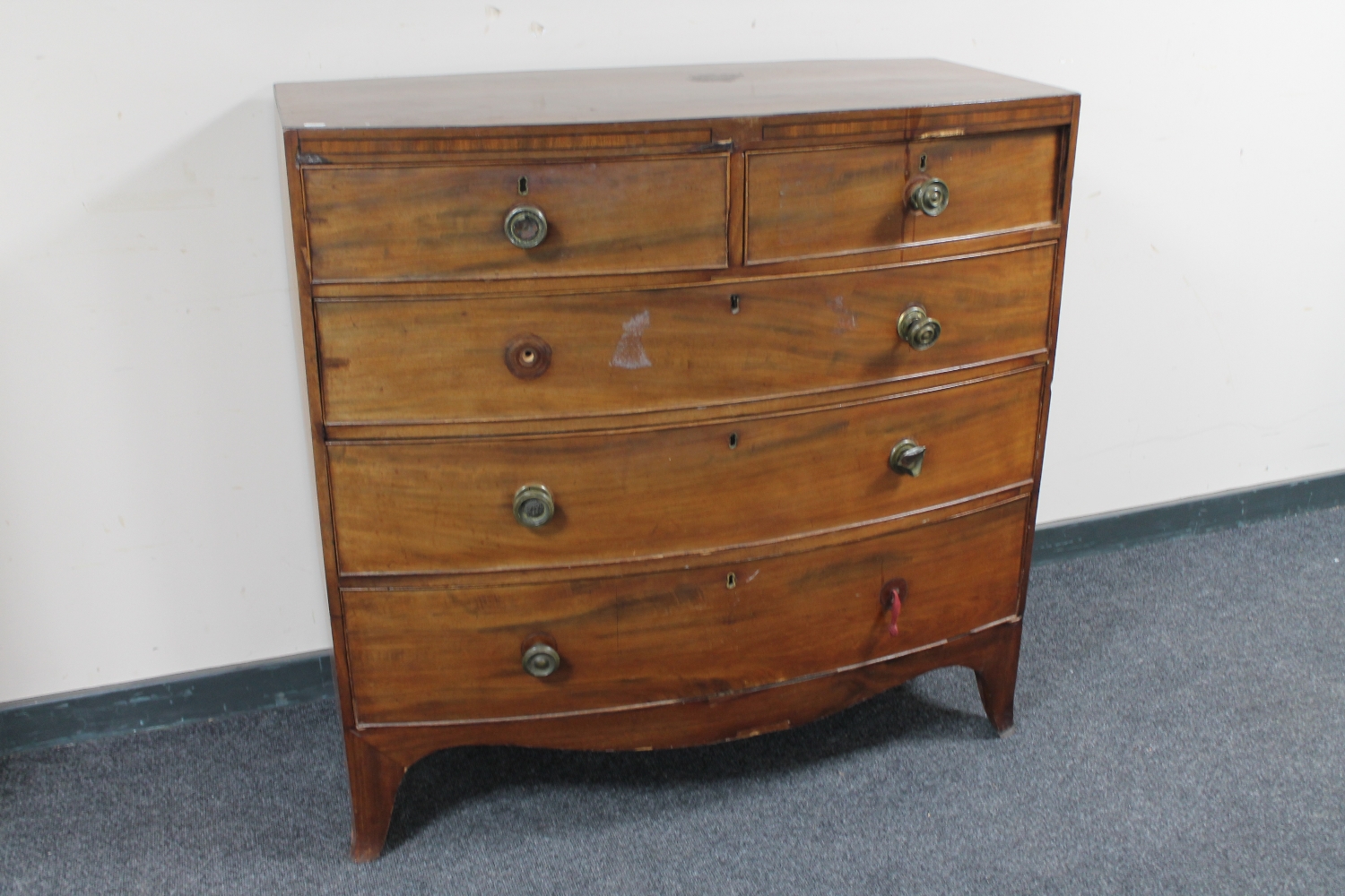 A Victorian mahogany bow-fronted five drawer chest