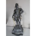 An antique bronzed statue of a classical warrior,