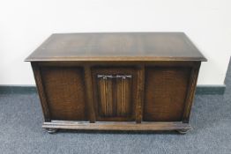 An oak linen fold blanket box