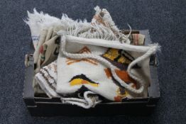 A box of two woollen rugs and assorted Hessian coffee sacks