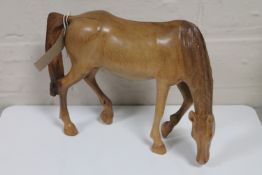 A wooden figure of a horse