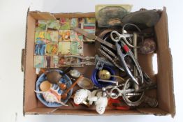 A box of vintage jigsaws, vintage jigsaw blocks, nut crackers, horse bit,