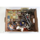 A box of vintage jigsaws, vintage jigsaw blocks, nut crackers, horse bit,