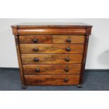 A Victorian mahogany six drawer chest with pillar column supports