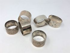 Three pairs of heavy gauge silver serviette rings, 314g.