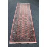 A Baluchi style runner on pink ground