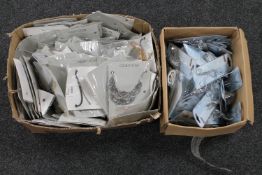 Two boxes of eye lash curlers and fashion costume jewellery