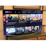 A Samsung 55" LED TV model number UE55h7000 with two remotes,