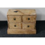 An antique pine miniature four drawer chest