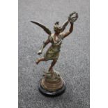 An early 20th century painted spelter figure of Hermes on wooden base