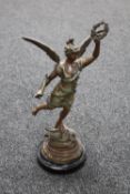 An early 20th century painted spelter figure of Hermes on wooden base